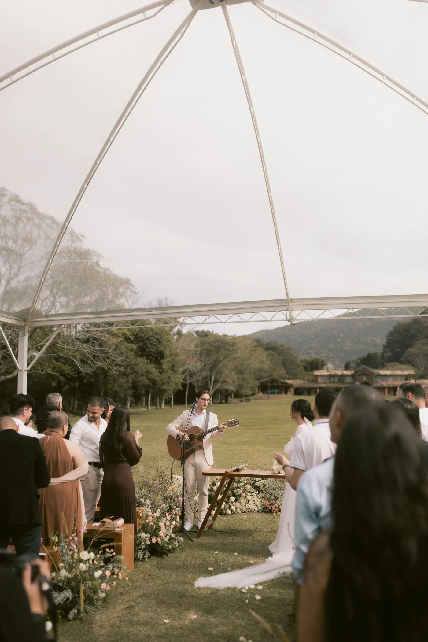 Wedding DJ setup with speakers and microphones.
