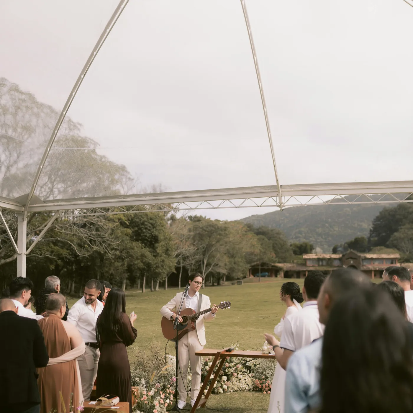 Wedding DJ setup with speakers and microphones.